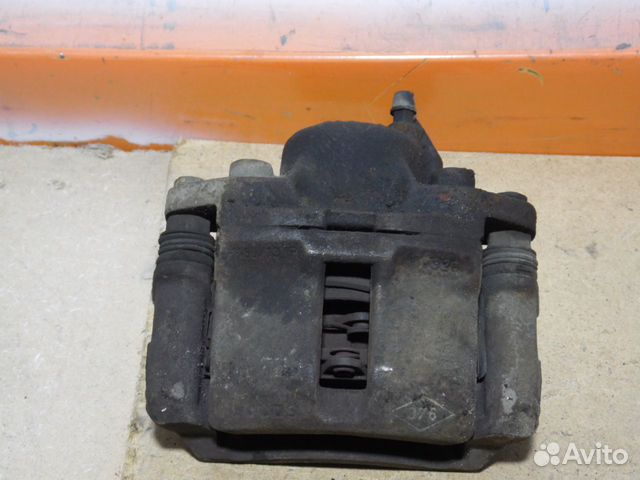 Суппорт тормозной передний правый Рено Логан