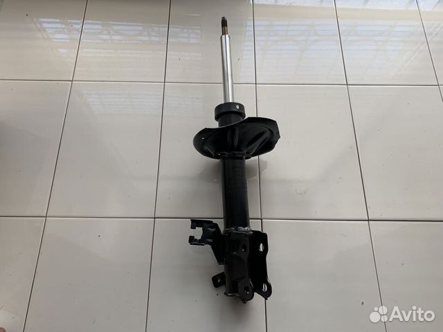 Амортизатор перед лев Nissan Almera N16 Хэтчбек